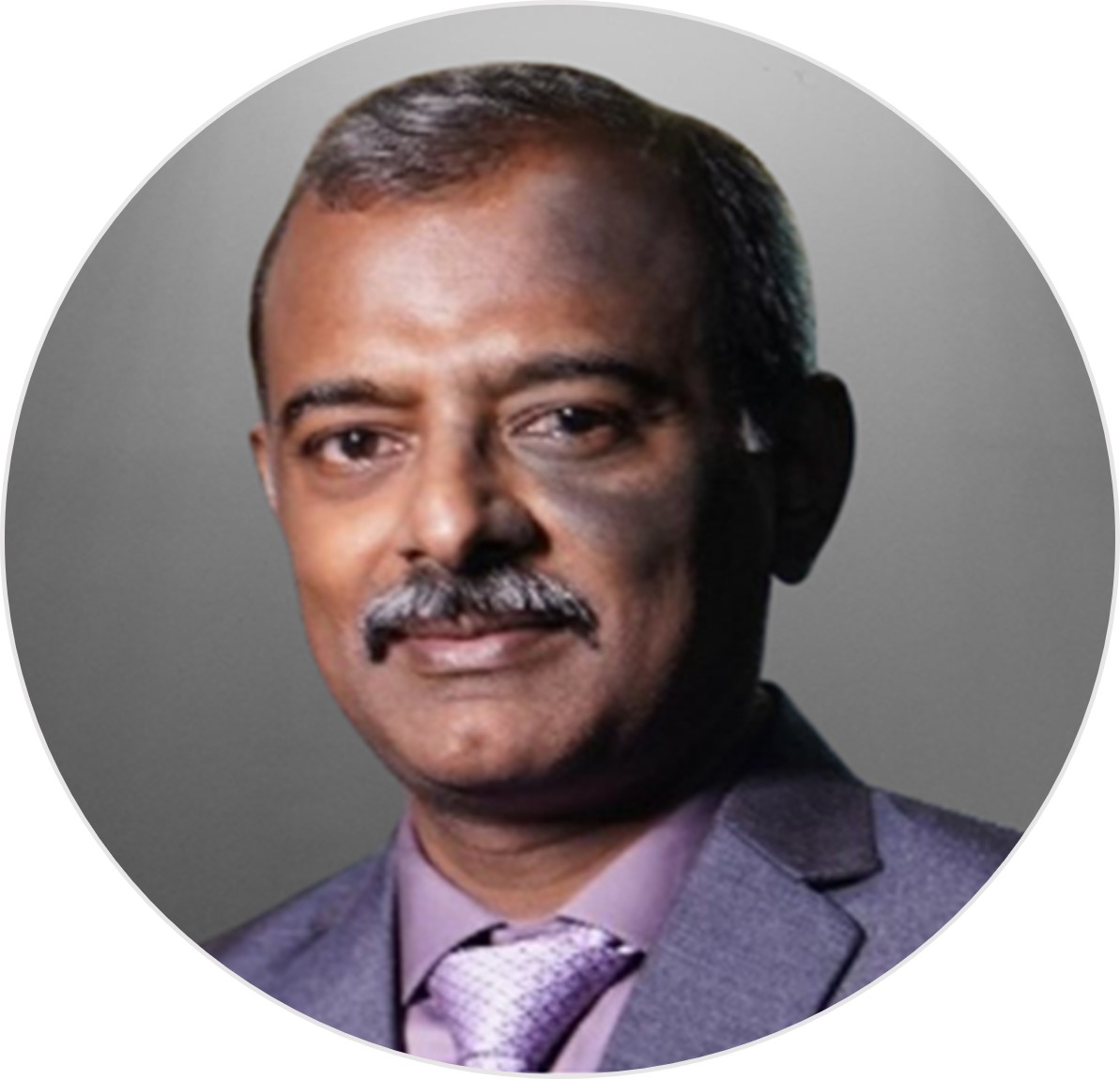 A professional portrait of Krishnamurthy